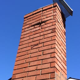 Before shot with broken cap and exposed broken bricks and missing mortar