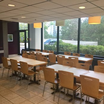 Paradise Cafe - tables and chairs facing a large window - American Near Me - Mississauga, Ontario Paradise Cafe - tables and chairs facing a large window - American Near Me - Mississauga, Ontario