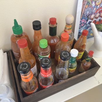 Taco Rice Hawaii - Plethora of hot sauces you can add to your taco rice! - Japanese Near Me - Honolulu, Hawaii
