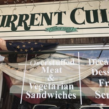 Current Cuisine Deli - a sign in the window - Delis Near Me - Yellow Springs, Ohio