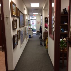 St. Vincent de Paul Thrift Store - One of the hallways, art on the walls for sale, leading to the ten treasure-filled rooms.