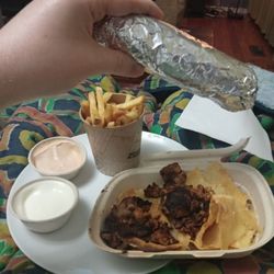 Guzman y Gomez - My entire takeaway menu. Burrito. Chips with chipotle and sour cream for dipping. Nachos with grilled chicken pieces.