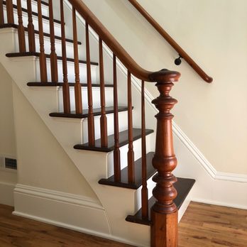 Conin Floors - a wooden banister on a staircase - Flooring Near Me Conin Floors - a wooden banister on a staircase - Flooring Near Me