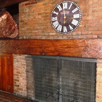 Dude Rancher Lodge - Rough-hewed mantel.  Credit Barbara L. Steinberg - Hotels Near Me - Billings, Montana