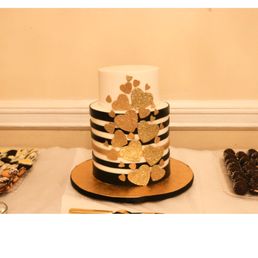 Black White and Gold 3 tier birthday cake. Black White and Gold 3 tier birthday cake.