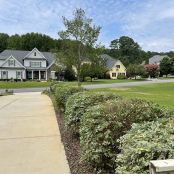Oak City Lawn Care Service - a home in the background - Lawn Services Near Me Oak City Lawn Care Service - a home in the background - Lawn Services Near Me