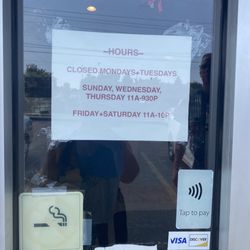 Four Seas Pizza & Restaurant - Hours listed in the front window, they do close completely sometimes for vacation, as understandable for a family run business