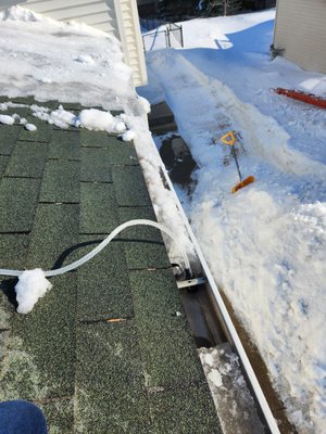Roof snow removal and ice dam removal - Ice dams can cause severe damage to your home. If left untreated, they can tear off your gutters, loosen shingles, and cause water to back up under those shingles and drain into your home. Water that cannot drain off properly works its way under your roof covering and flows into the attic.