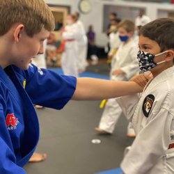 Leaders for Life - An Instructor Practicing with a child