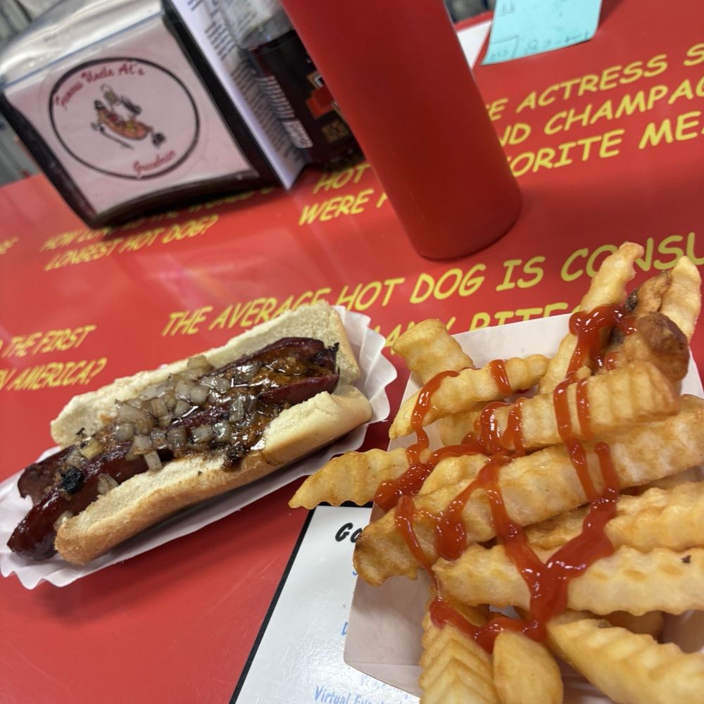 1/4 pound hot sausage, chili, grilled onions.  Fries