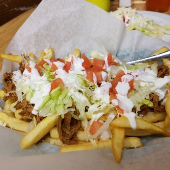 Tacos Tony - a taco sandwich with shredded lettuce and tomatoes - Mexican Near Me - Leamington, Ontario Tacos Tony - a taco sandwich with shredded lettuce and tomatoes - Mexican Near Me - Leamington, Ontario