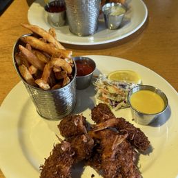Coconut prawns with coleslaw and fries Coconut prawns with coleslaw and fries