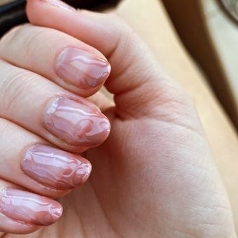 VS Nail Bar - The "fixed" nails. - A hand with manicured nails featuring a pink and white marbled gel polish design, held in a relaxed position. - Nail Salons Near Me - Phoenix, Arizona