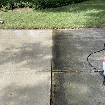 Lake Projects & Services - In-progress photo of a driveway pressure washing job. - Gutter Services Near Me Lake Projects & Services - In-progress photo of a driveway pressure washing job. - Gutter Services Near Me