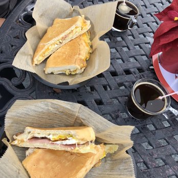 Express Cafe - Cuban Sandwich Top: Eggs Ham Cheese Bottom: Fried egg ham Swiss cheese - Coffee & Tea Near Me - Kissimmee, Florida Express Cafe - Cuban Sandwich Top: Eggs Ham Cheese Bottom: Fried egg ham Swiss cheese - Coffee & Tea Near Me - Kissimmee, Florida