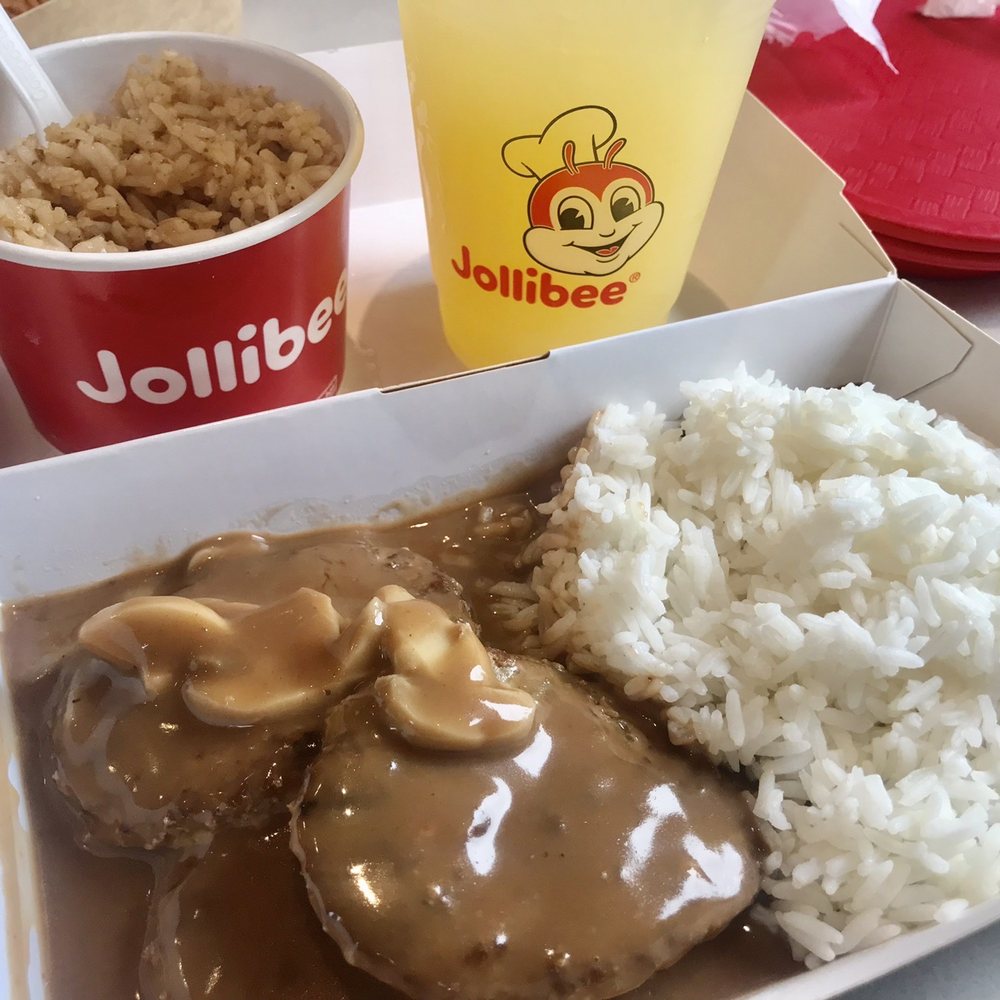 Hamburger steak platter with side order adobo fried rice n a refreshing pineapple drink so good!