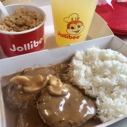 Hamburger steak platter with side order adobo fried rice n a refreshing pineapple drink so good!