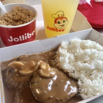 Jollibee - Hamburger steak platter with side order adobo fried rice n a refreshing pineapple drink so good! - Fast Food Near Me - Honolulu, Hawaii