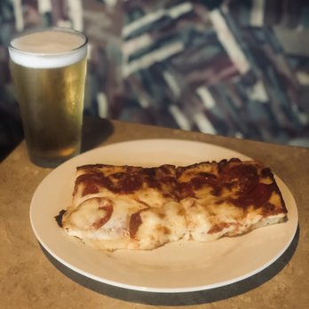Ruggero's - a slice of pizza and a pint of beer - Pizza Near Me - Flint, Michigan