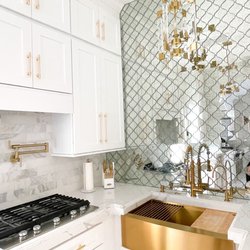 Gila Cabinet & Stone Center - Aphrodite counters and white shaker cabinets gold faucet also from Gila