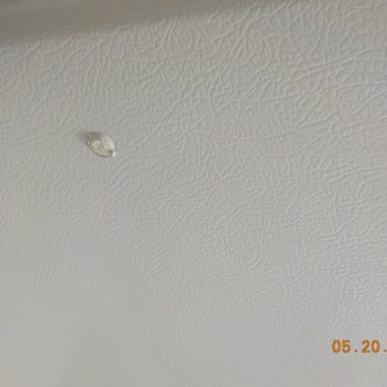 Drimmers Appliances - Damaged deformed dirty plug in plug hole in front of GE Refrigerator sold & delivered by Drimmers. - Appliances Near Me - Brooklyn, New York