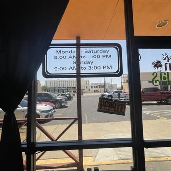 Cafe San Blas - a view of a parking lot through a window - Mexican Near Me - Odessa, Texas Cafe San Blas - a view of a parking lot through a window - Mexican Near Me - Odessa, Texas