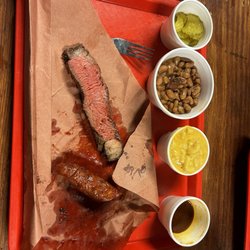 Cooper's Old Time Pit Bar-B-Que - Sausage, top sirloin, macaroni and cheese, beans, picks and BBQ sauce.