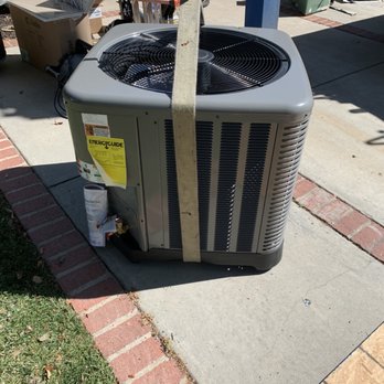 Dave's Heating & Air Conditioning - About to lift the new condenser onto the roof. - Heating & Air Conditioning/HVAC Near Me