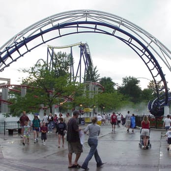 Corkscrew - It's pretty cool how the inversions twist over the midway (Iron Dragon in the misty background) - Amusement Parks Near Me - Sandusky, Ohio