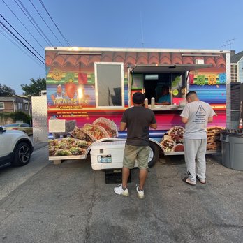 Tacos Los Dos Compadres - two men ordering food from a food truck - Food Trucks Near Me - Mount Vernon, New York