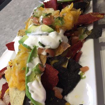Raices - This is the nachos, it only brings 3slices of avocado and a little bit of cheese with onions. Don't recommend it at all. - Colombian Near Me - Jackson Heights, New York Raices - This is the nachos, it only brings 3slices of avocado and a little bit of cheese with onions. Don't recommend it at all. - Colombian Near Me - Jackson Heights, New York