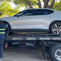 Benson Auto EV solutions - Kevin@Benson Auto EV Solutions loading a Polestar 2 on flatbed