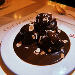Café de Paris - Chocolate covered little doughnuts ?