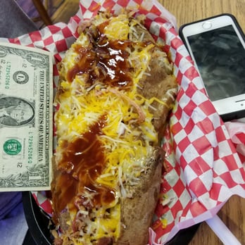 Corner Clubhouse - Their Grand Slam baked potato, covered with pulled pork, cheese, onions and BBQ sauce.  It is kinda BIG, and tasty. - Sports Bars Near Me - Magnolia, Arkansas