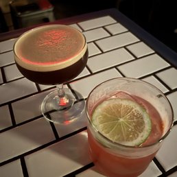two cocktails on a table two cocktails on a table