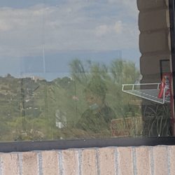 Chaparral Convenience Store - Well the lady isn't wearing her face mask as she was working with the food. I left.