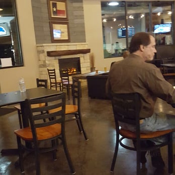 Whitestone Brewery - Not a real fireplace, but looks nice! - Breweries Near Me - Cedar Park, Texas