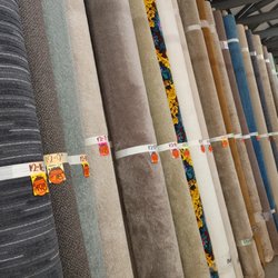 Cash & Carry Carpet Outlet - Over 1,000 room-size carpet remnants along the walls