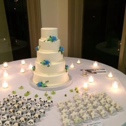 Wink by Erica - Macarons set up next to the wedding cake
