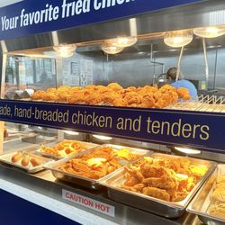 Tidal Wave Car Wash - Fried chicken, onion rings, and breakfast sandwiches for sale.