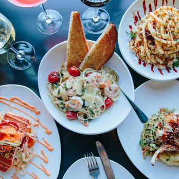 110 Grill Providence - plates of food and glasses of wine - New American Near Me - Providence, Rhode Island 110 Grill Providence - plates of food and glasses of wine - New American Near Me - Providence, Rhode Island