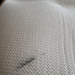 The drying pad that got black Stain from the skillet i bought from REI in Burbank . The drying pad that got black Stain from the skillet i bought from REI in Burbank .