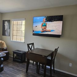 Best Buy - Tv mounted with swivel mount by Best Buy