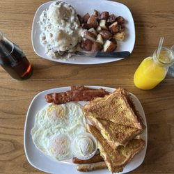 Cafe on Main - Two eggs bacon sausage with french toast freshly squeezed orange juice southern style eggs benedict with fries