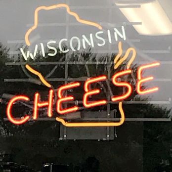 Kugel's Cheese Mart - a neon sign in the window - Cheese Shops Near Me - Lena, Wisconsin Kugel's Cheese Mart - a neon sign in the window - Cheese Shops Near Me - Lena, Wisconsin