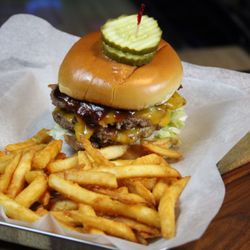 Stars and Strikes - Two smashed burgers layered with cheddar cheese, bacon, and bbq sauce (served with lettuce, tomato, onion & pickle)