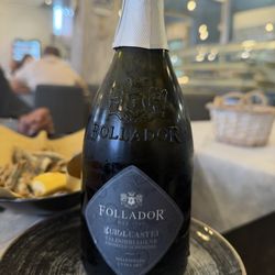 Osteria Pescheria - Their brut prosecco.  I thought it was by the glass but it came by the bottle.  No complaints here!
