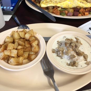 Main St. Deli - Home fries and biscuit with gravy that comes with the country breakfast - Breakfast & Brunch Near Me - Buford, Georgia
