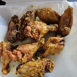Nevados Pizza - Lemon Pepper wings after we each ate one! Delicious & crispy.