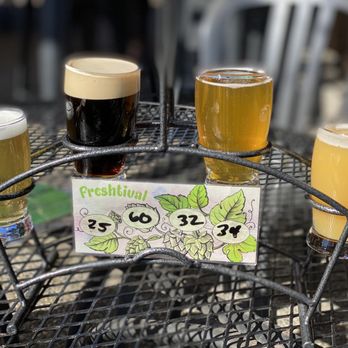 The Growler Guys - Flight of beer (left to right): Local 66 - Lager (nitro), First Mug Mocha - Porter (nitro), Johnny Utah - Pale Ale, and Terpene Soup - IPA. - Beer Gardens Near Me - Seattle, Washington The Growler Guys - Flight of beer (left to right): Local 66 - Lager (nitro), First Mug Mocha - Porter (nitro), Johnny Utah - Pale Ale, and Terpene Soup - IPA. - Beer Gardens Near Me - Seattle, Washington